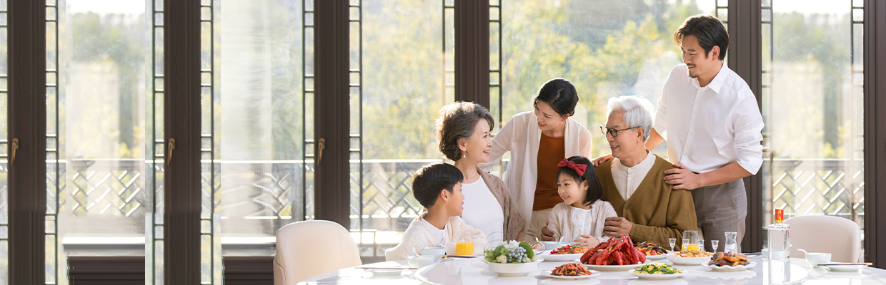 A family are on a sofa; image used for HSBC Singapore Premier Mastercard