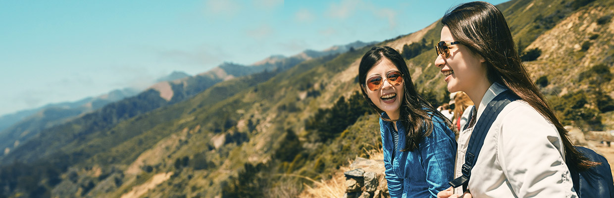 Two laughing grils on the hill; image used for Credit Card card instalment payment Page.